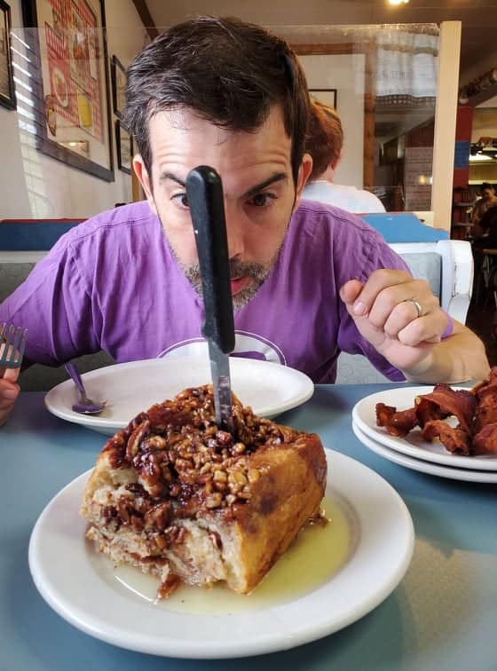 It takes two people to split the giant cinnamon roll at Sherrie's i, WY