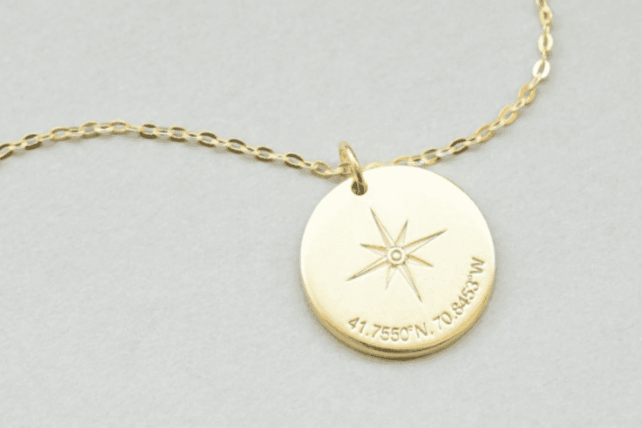 A gold personalized compass pendant necklaces are perfect gifts for the woman who wants nothing