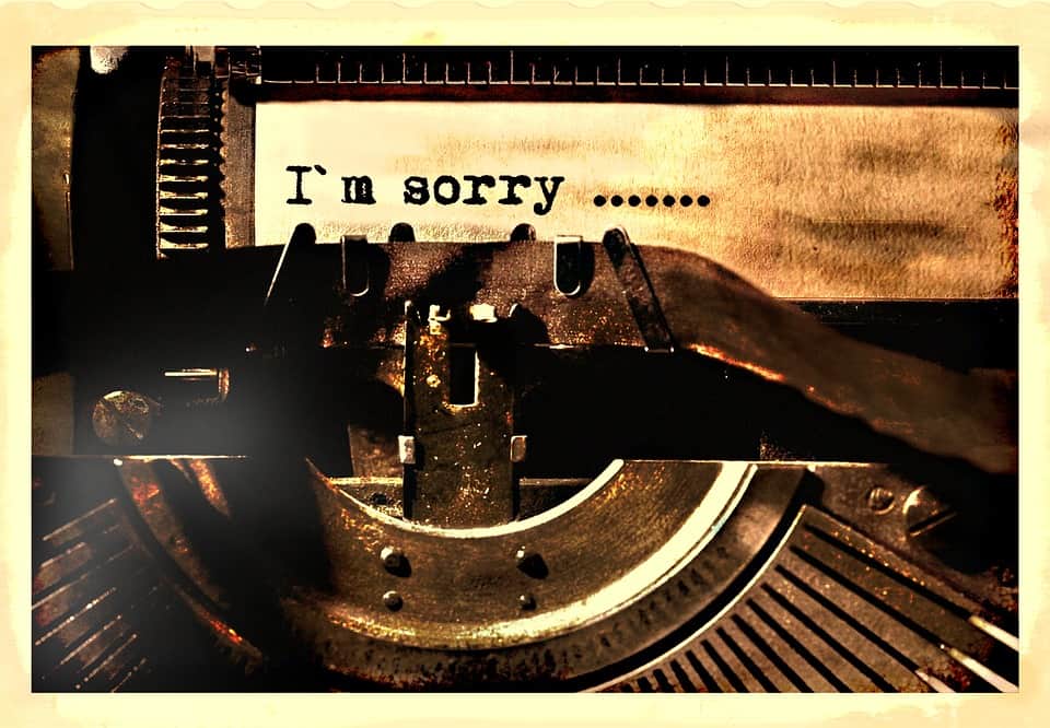 A typewriter typing a letter that says I am sorry in hopes of Making Amends