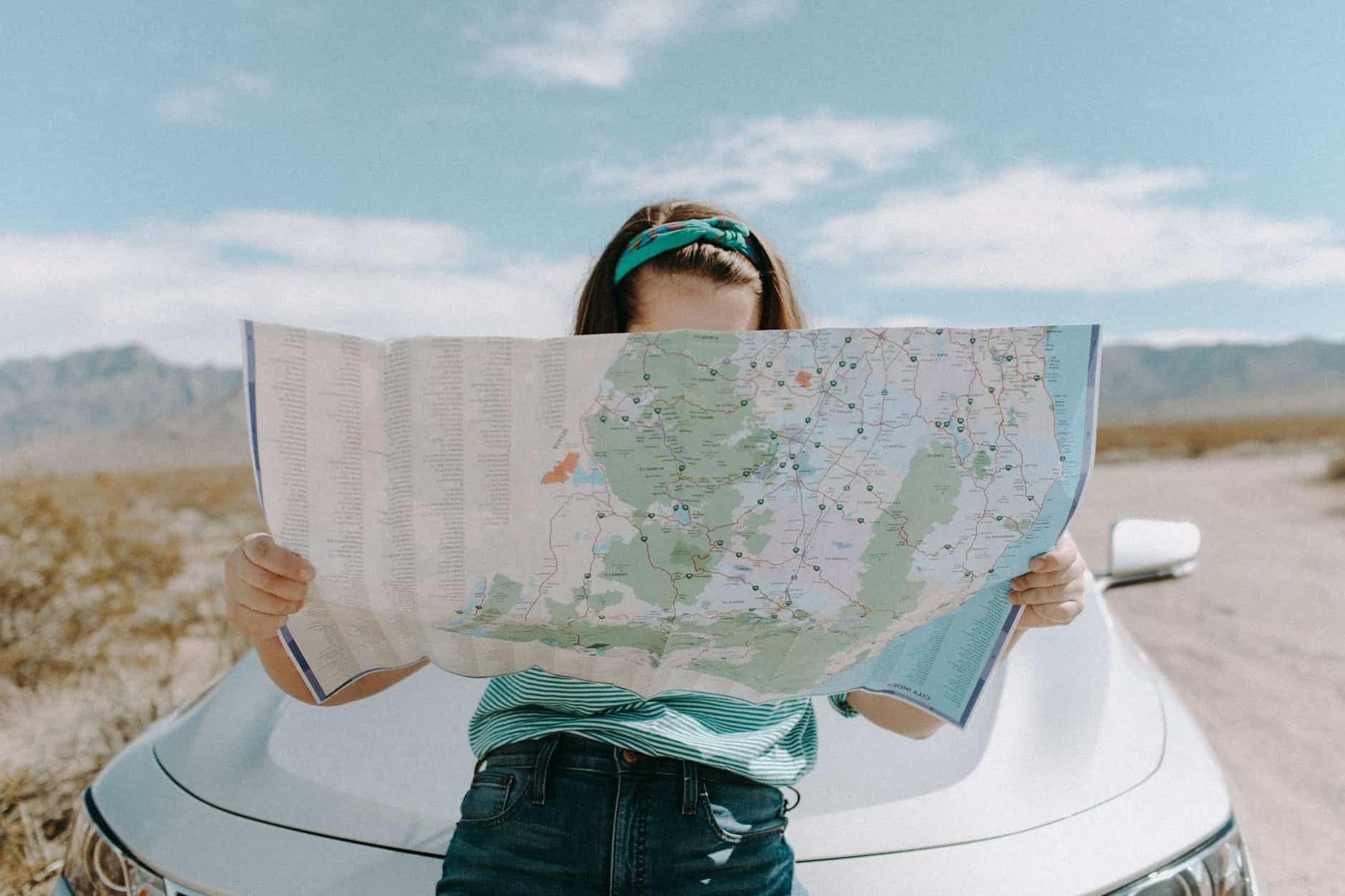 A woman Looking at a Map for her Travel planning