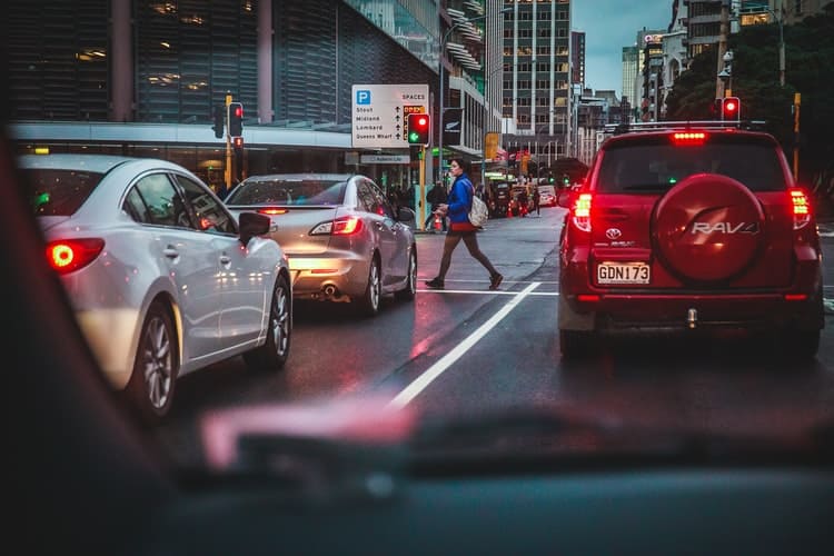 Paying attention to other drivers and pedestrians during traffic